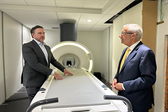 Synaptive Founder, Cameron Piron, and Minister of Economic Development, Victor Fedeli looking at Synaptive Medical MRI