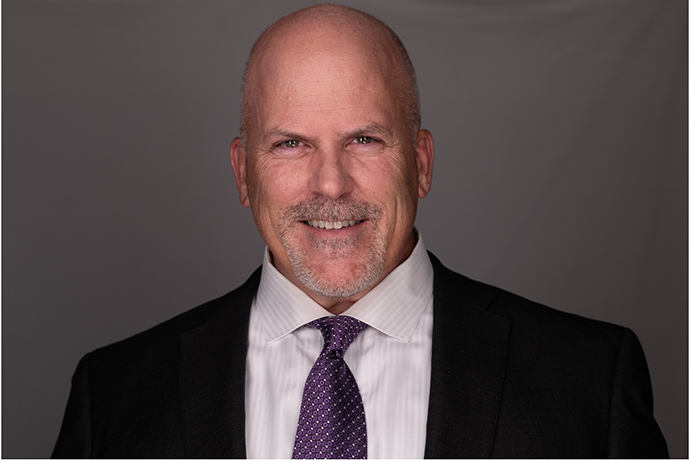 head shot of man in suit